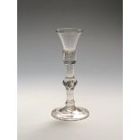 A baluster cordial glass c.1715, the short waisted bucket bowl rising from a thick base with