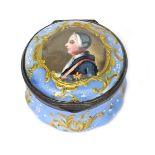 An English enamel patch box c.1760-70, painted with a profile portrait of George III, within a