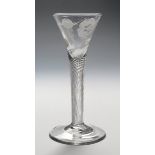 A wine glass of Jacobite type c.1760, the drawn trumpet bowl engraved with a rose and rosebud