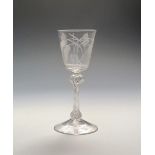 An ale glass c.1760, unusually with a flared bucket bowl engraved with crossed double stems of