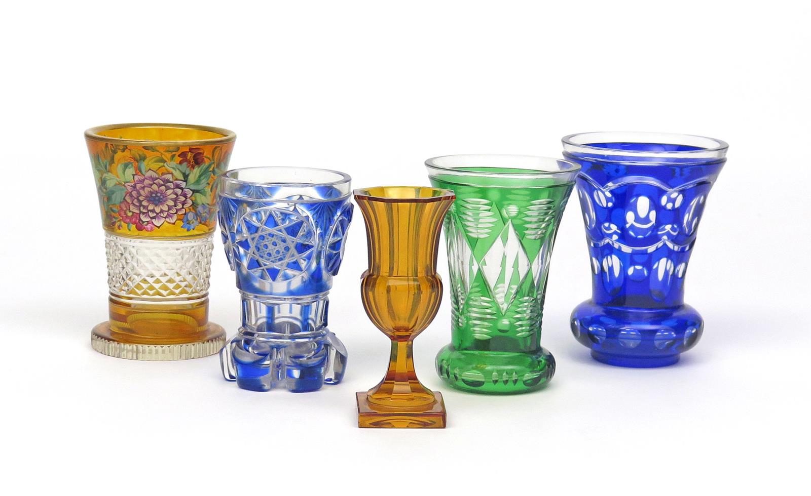 Five Bohemian glass small vases or goblets 19th century, two of flared form flashed in blue, one