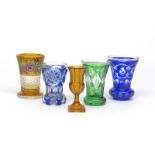 Five Bohemian glass small vases or goblets 19th century, two of flared form flashed in blue, one