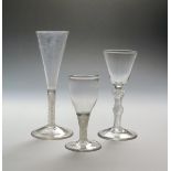 Three wine glasses c.1760-70, one with a rounded funnel bowl raised on a double knopped airtwist