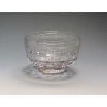 An early glass bowl c.1720, the outer rim with trailed rings above a diamond moulded base over a low