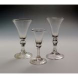 Two light baluster wine glasses c.1730, with bell bowls raised on inverted baluster stems