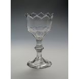 A heavy sweetmeat glass c.1780, the deep bowl finely cut with a dentate rim, the fluted bowl base