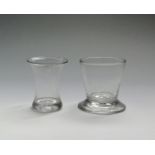 Two glass beakers c.1760-70, one of waisted form on a thick base, the other of flared bucket form