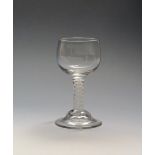 A mead or honey glass c.1770, with generous cup shaped bowl raised on a short double series opaque