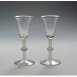 A pair of Dutch wine glasses c.1770, the bell bowls raised on knopped opaque twist stems, 17cm. (2)