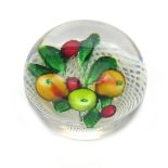 A St Louis fruit paperweight c.1850, set with a pear, two apples and three cherries on leafy