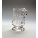 A glass mug or tankard dated 1775, the bell shaped body engraved with the initials 'A I W' above the