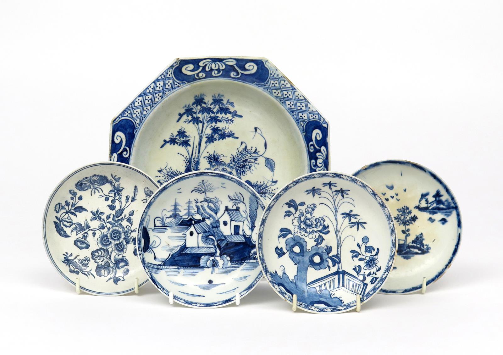 Four Lowestoft blue and white saucers c.1770, two painted with Chinese island landscapes, one with