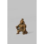 AN INDIAN COPPER FIGURE OF THE BABY KRISHNA 16TH CENTURY Cast as a kneeling baby adorned with