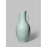 A JAPANESE CELADON VASE 20TH CENTURY The slender body decorated with an unctious blue glaze, the