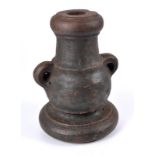 A cast iron 1.5 in. miniature mortar, of pronounced bottle-shape and standing upright on a circular
