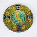 A large Della Robbia wall charger by Gwendoline Buckler, incised to the well with a lion rampant,