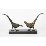An Art Deco patinated metal model of two exotic pheasants, on rectangular polished black slate