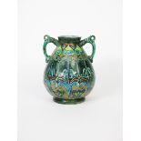 A Della Robbia Pottery Cantagalli twin-handled vase by Gertrude Russell, swollen form with applied