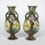 A pair of Minton's Secessionist twin-handled vases designed by Leon Solon and John Wadsworth, footed