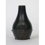 An unusual Sunflower Pottery vase by Sir Edmund Elton, ovoid with tapering neck, the base applied