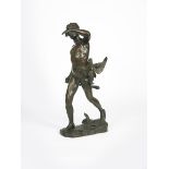 A large patinated bronze figure of a young boy hunting by Maurice Bouval, modelled holding a