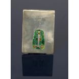 A Liberty & Co Cymric silver and enamel aide memoire, rectangular hinged form, cast in low relief