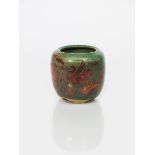 A lustre glazed pottery vase in the manner of Bushey Pottery, shouldered cylindrical form with