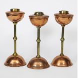 A pair of W.A.S Benson copper and brass oil lamps , model no. 72, each on domed copper foot, with