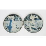 A pair of Arts and Crafts pottery chargers possibly Copeland, each painted with a medieval maiden in