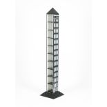 A Fornasetti Architettura CD rack, tall, slender rectangular form on stepped square foot and with