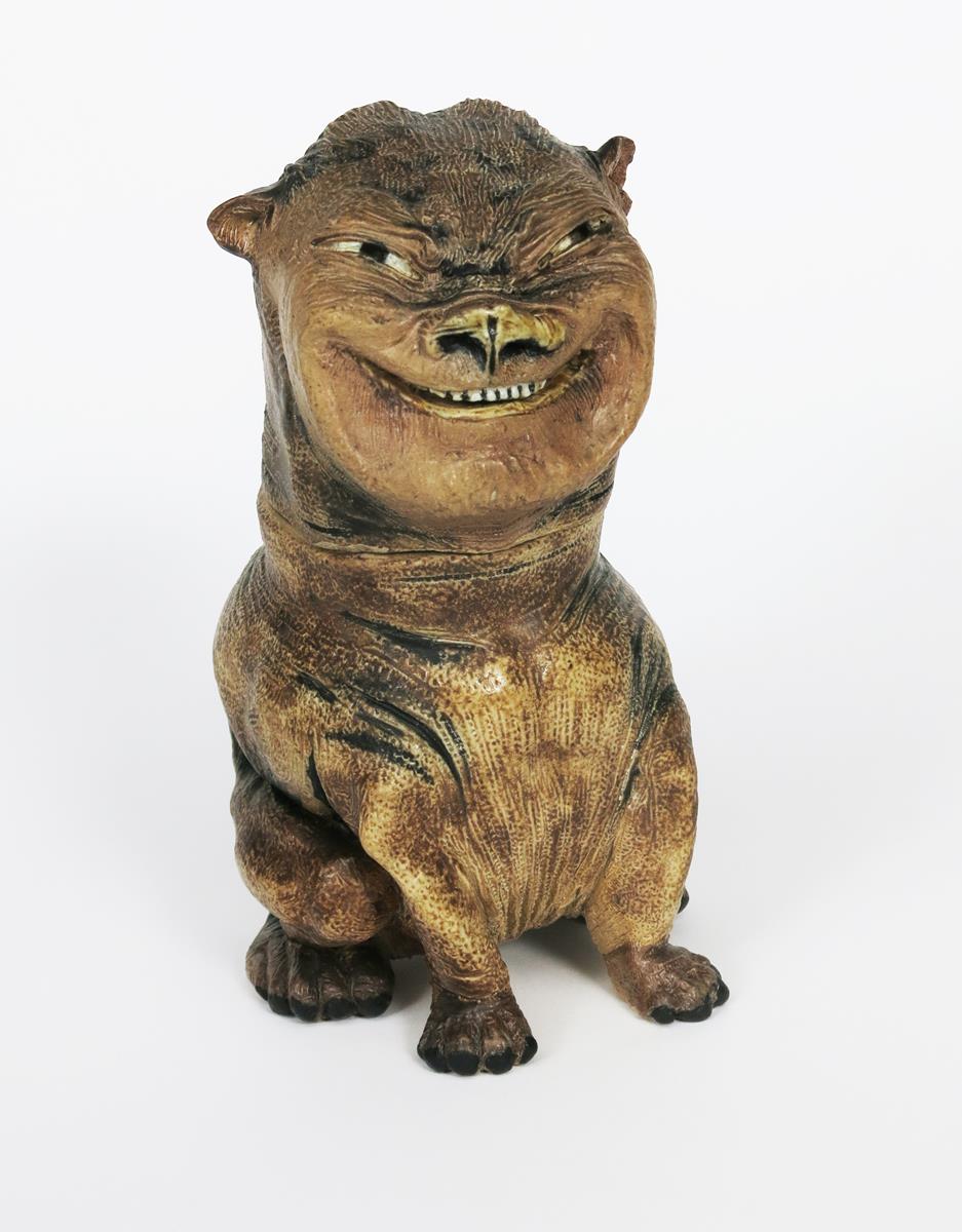 A unique Martin Brothers stoneware grotesque dog jar and cover by Robert Wallace Martin, dated 1884,