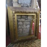 A Victorian gilded oak mirror/picture frame of rectangular wedge shape with raised acorn and oak