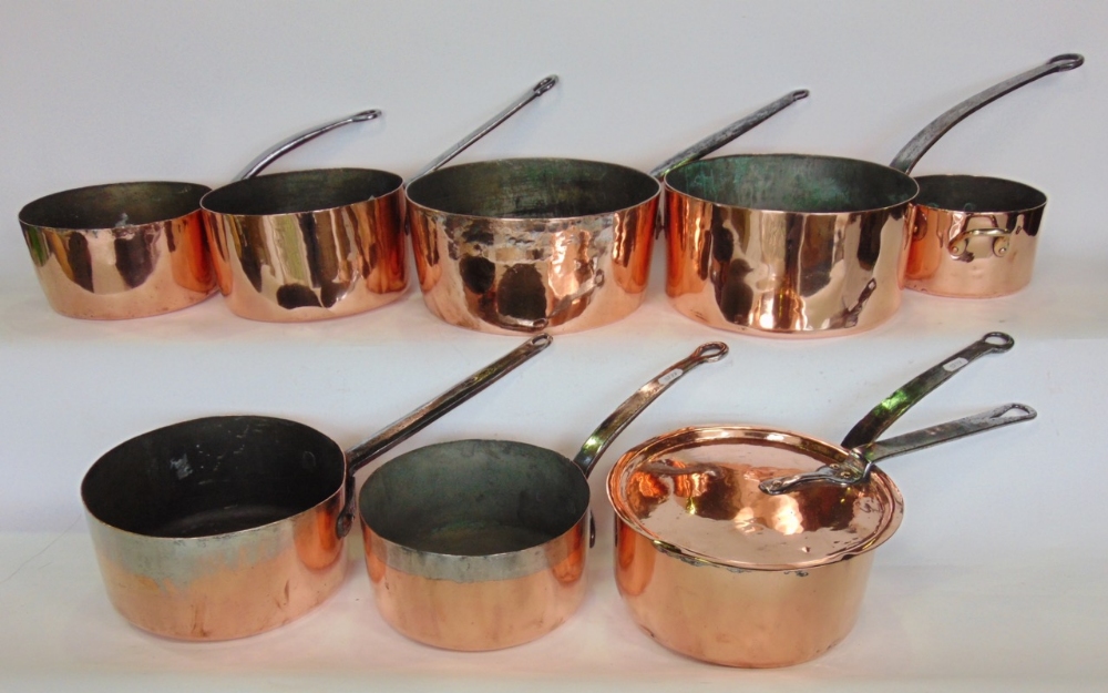 Harlequin set of eight various antique polished copper pans