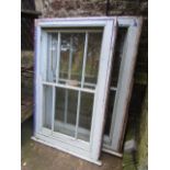 A reclaimed painted pine framed sash window with segmented glazed panels together with a matching