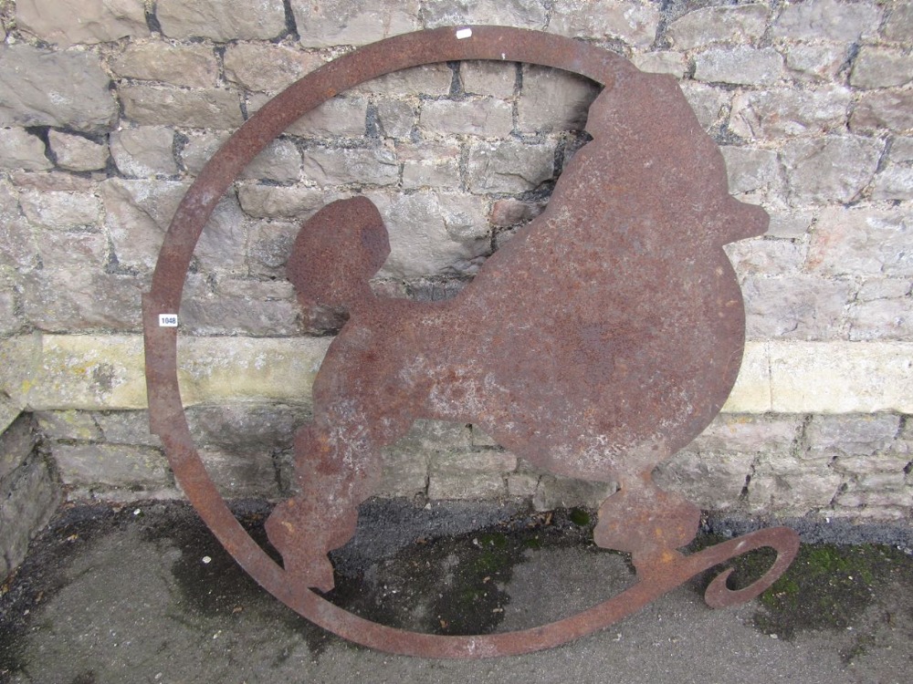 An unusual cut sheet metal plaque in the form of a poodle with scrolled ring outline, 120 cm