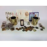 A box conta\ining coin packs, silver coinage, copper coinage and miscellanea