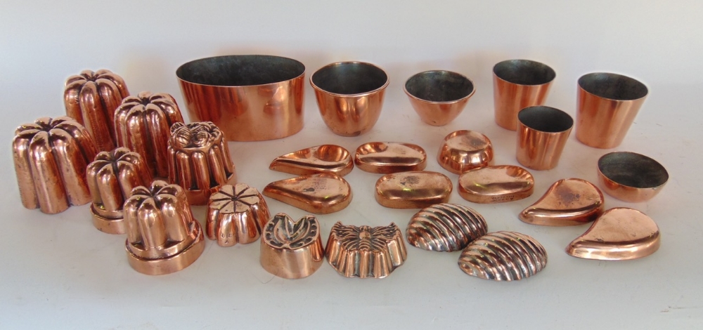 A large collection of small 19th century copper jelly moulds, a number inscribed Buszard Ltd (a