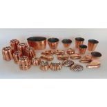 A large collection of small 19th century copper jelly moulds, a number inscribed Buszard Ltd (a