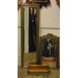 A reproduction pier mirror, the slender rectangular frame with bevelled edge plate and moulded