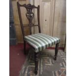 A set of four late Victorian walnut lightweight occasional chairs, the pierced vase shaped splats