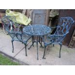 A contemporary cast aluminium three piece terrace set comprising table of circular form with