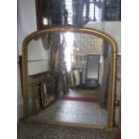 A good quality Victorian style overmantle mirror, the moulded gilt arched frame with rope twist