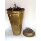 Continental brass stick stand of circular tapered form decorated in relief of a windmill and