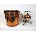Antique copper riveted log bin; together with a Benson style planished copper spirit kettle upon a