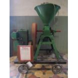 A Lister stationary engine powering a corn kibbler, type D, 1.5hp, serial number 118220, engine