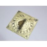 A small brass sundial complete with gnomon dated 1715, 10 cm square