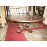 A good quality reproduction oak dining table in the old English style with distressed finish, the