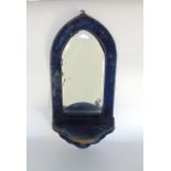 Victorian velvet arched wall bracket fitted with an arched bevelled mirror plate