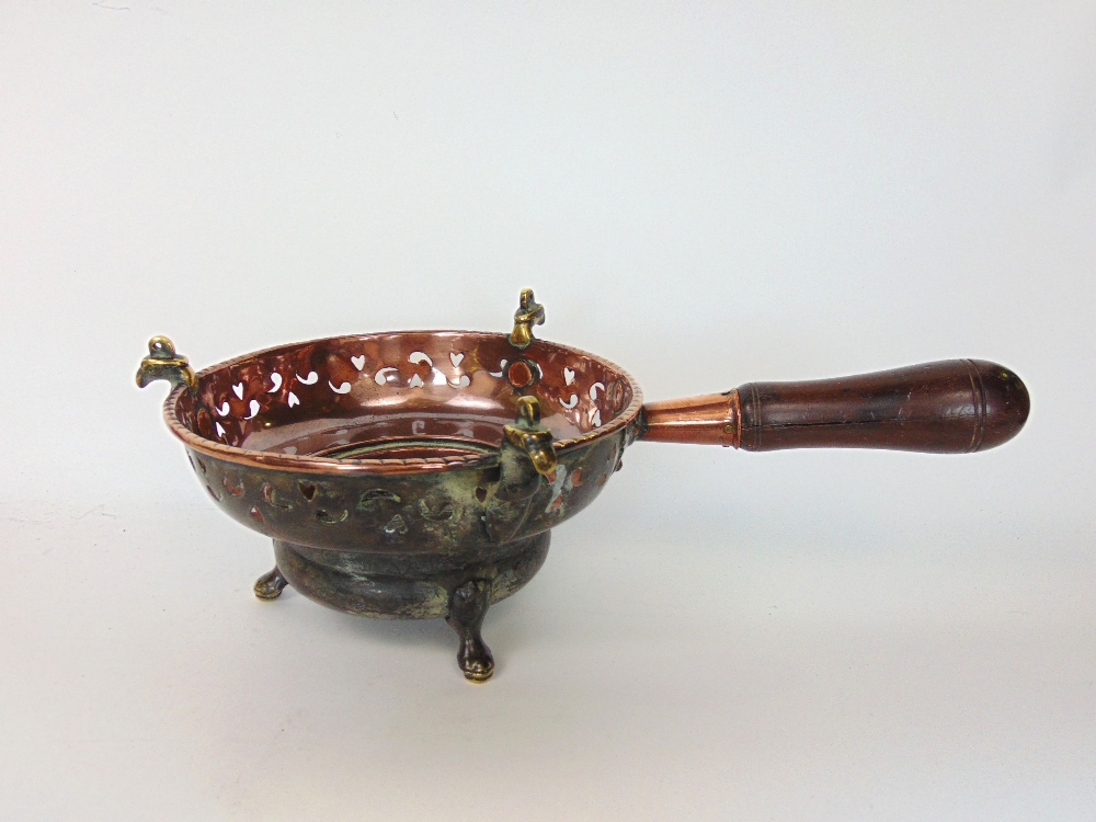 Three 19th century and earlier braziers, mainly in copper with turned wood handles