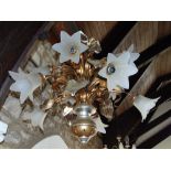 Impressive gilt metal and wood ceiling light with scrolled branches and floral fluted glass shades